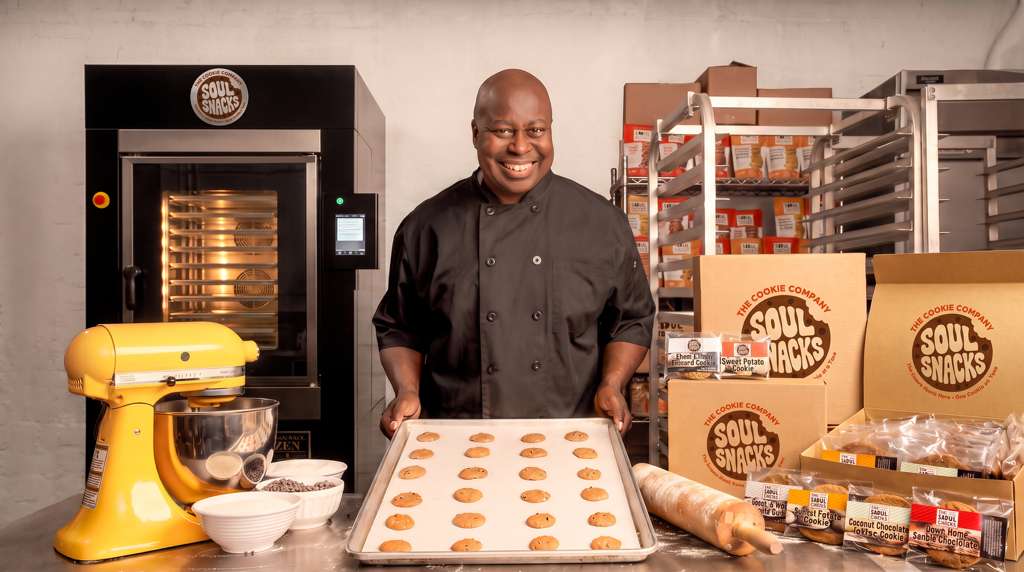 Soul Snacks founder with freshly baked cookies